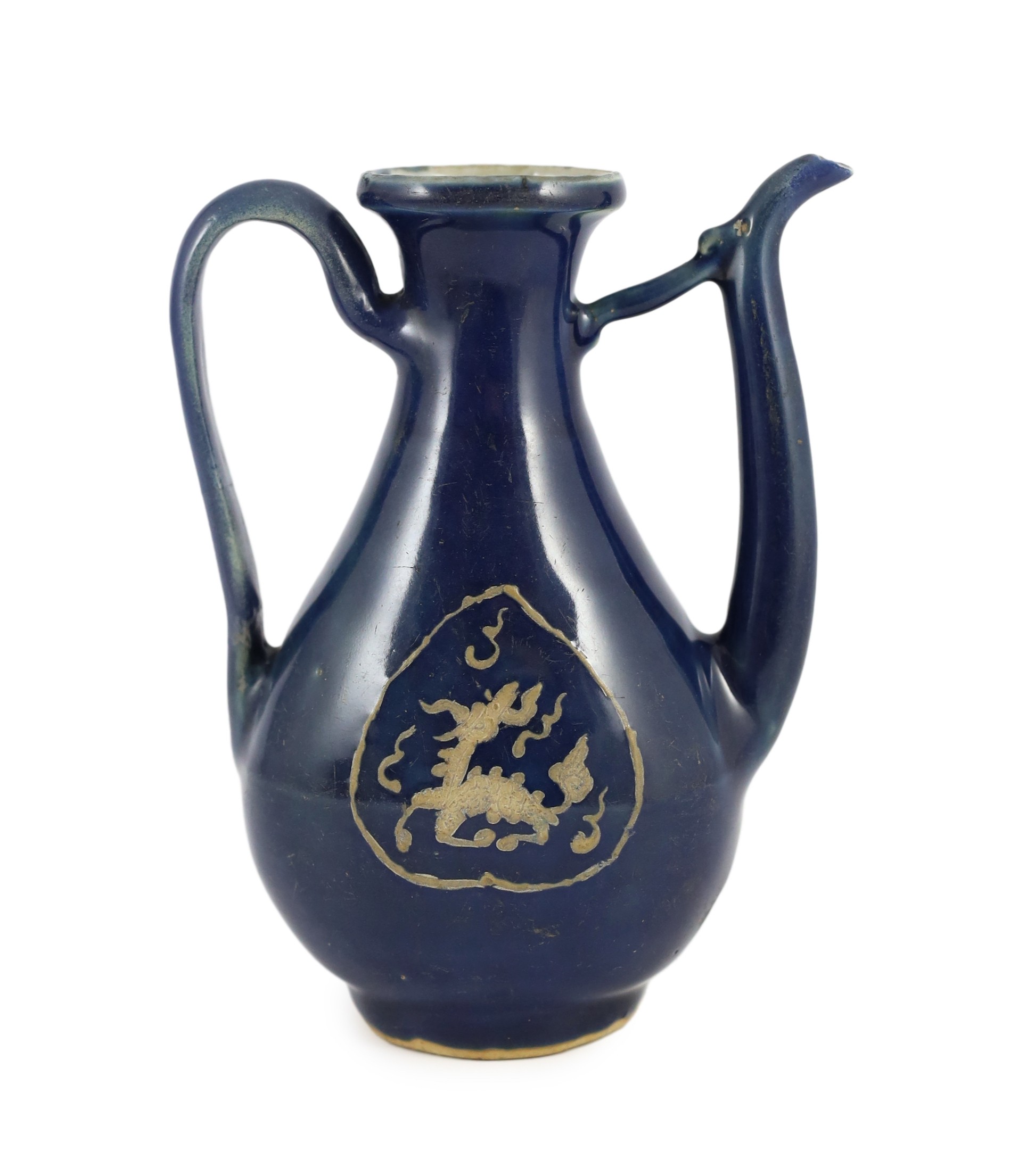 A Chinese late Ming blue glazed and slip decorated ‘qilin’ ewer, for the Islamic market, 19.5cm high, handle and tip of spout restored, wear